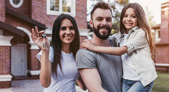 thumbnailfor Family outside their new home obtained through Washington State Home Loan