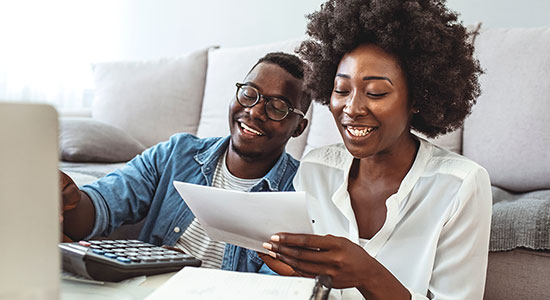 young couple reviewing financial documents