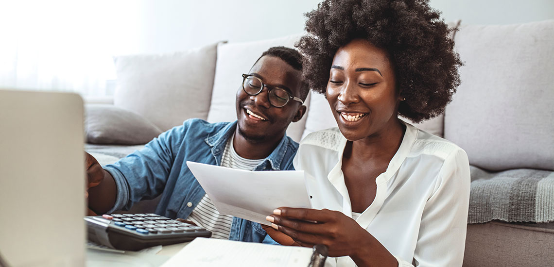Young couple reviewing financial documents