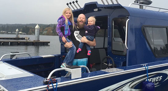 thumbnailfor boat owner with his children on his boat