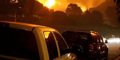 Cars evacuating from a fire