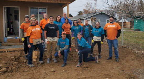 Solarity employees volunteering with Habitat for Humanity