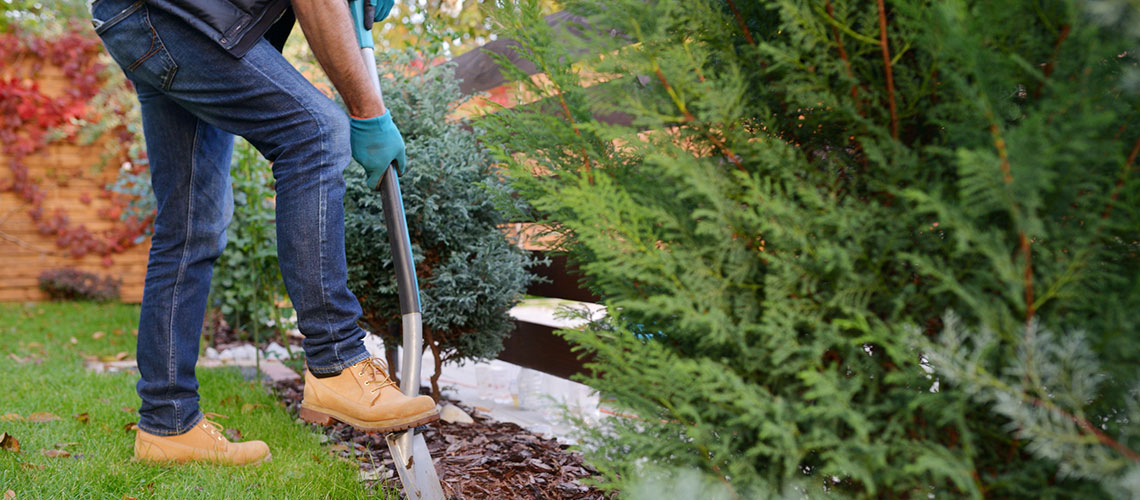 man-working-in-yard-1140x500