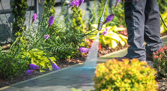 pressure-washing-walkway-to-improve-curb-appeal-550x300 Using a pressure washer to help improve curb appeal