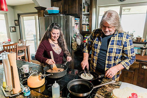 thumbnailfor Middle Age Couple Cooking Lunch together in new Home