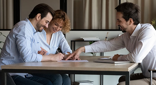 Man and woman reviewing home loan documents