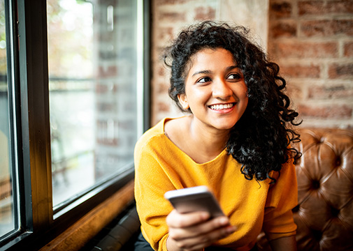 Young women holding phone