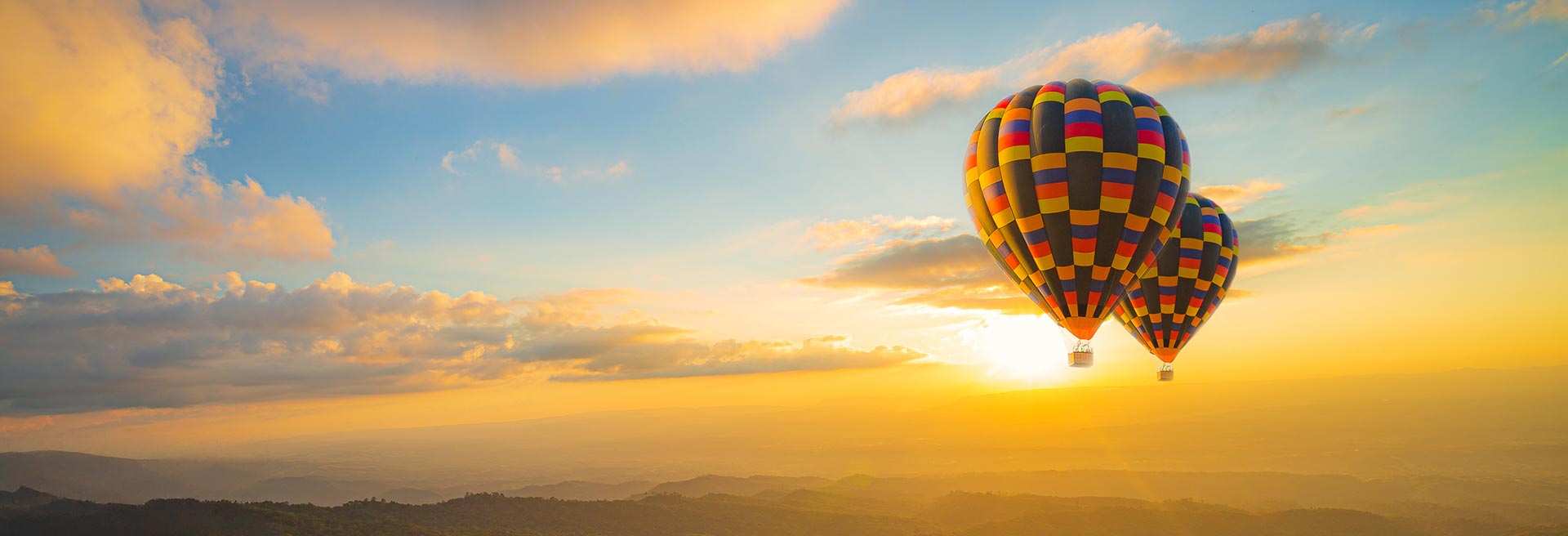 Hot air balloons floating across Washington State landscape