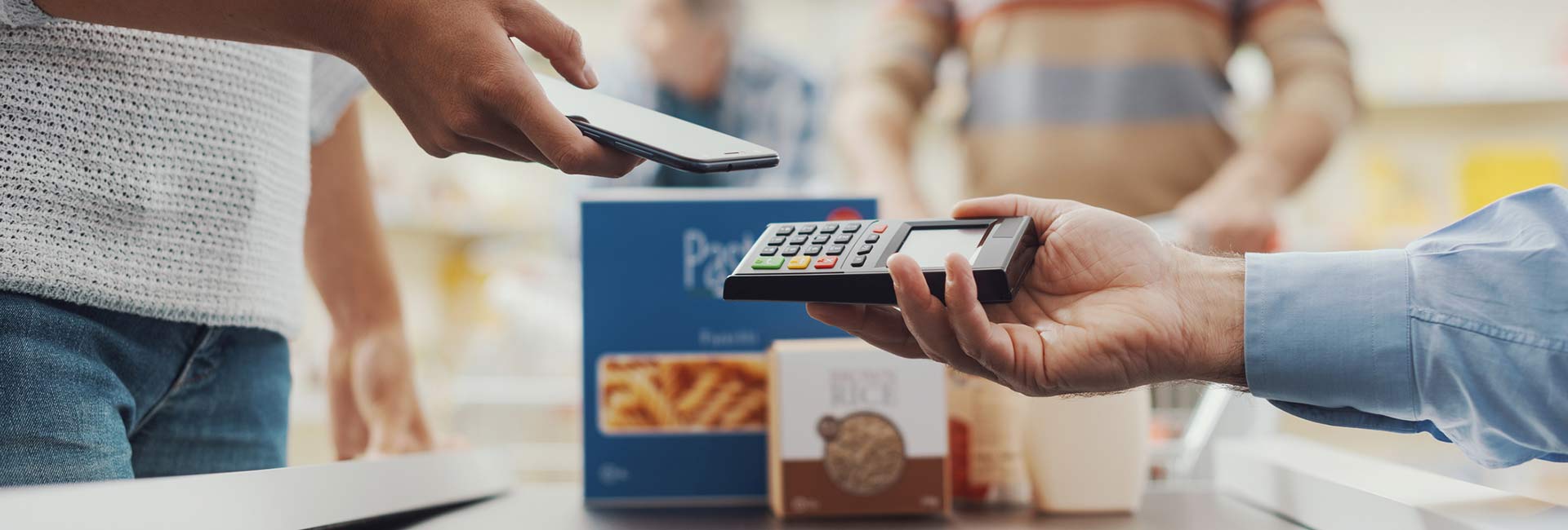 Woman earning round up savings at grocery store